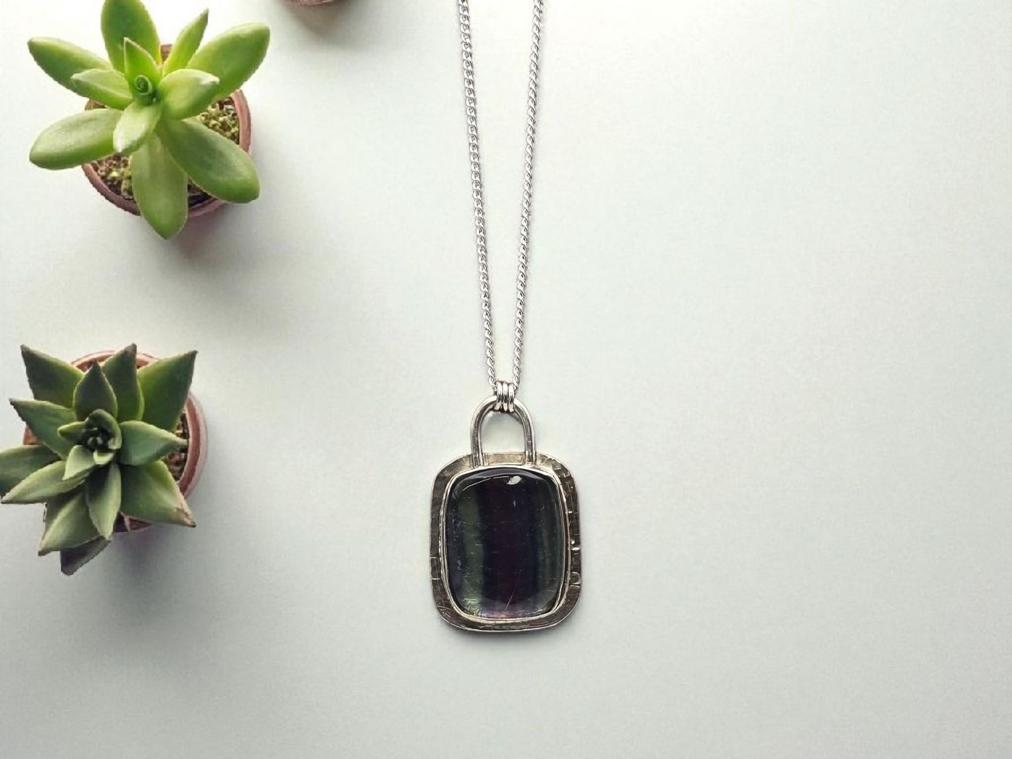 Pale green and purple glass pendent