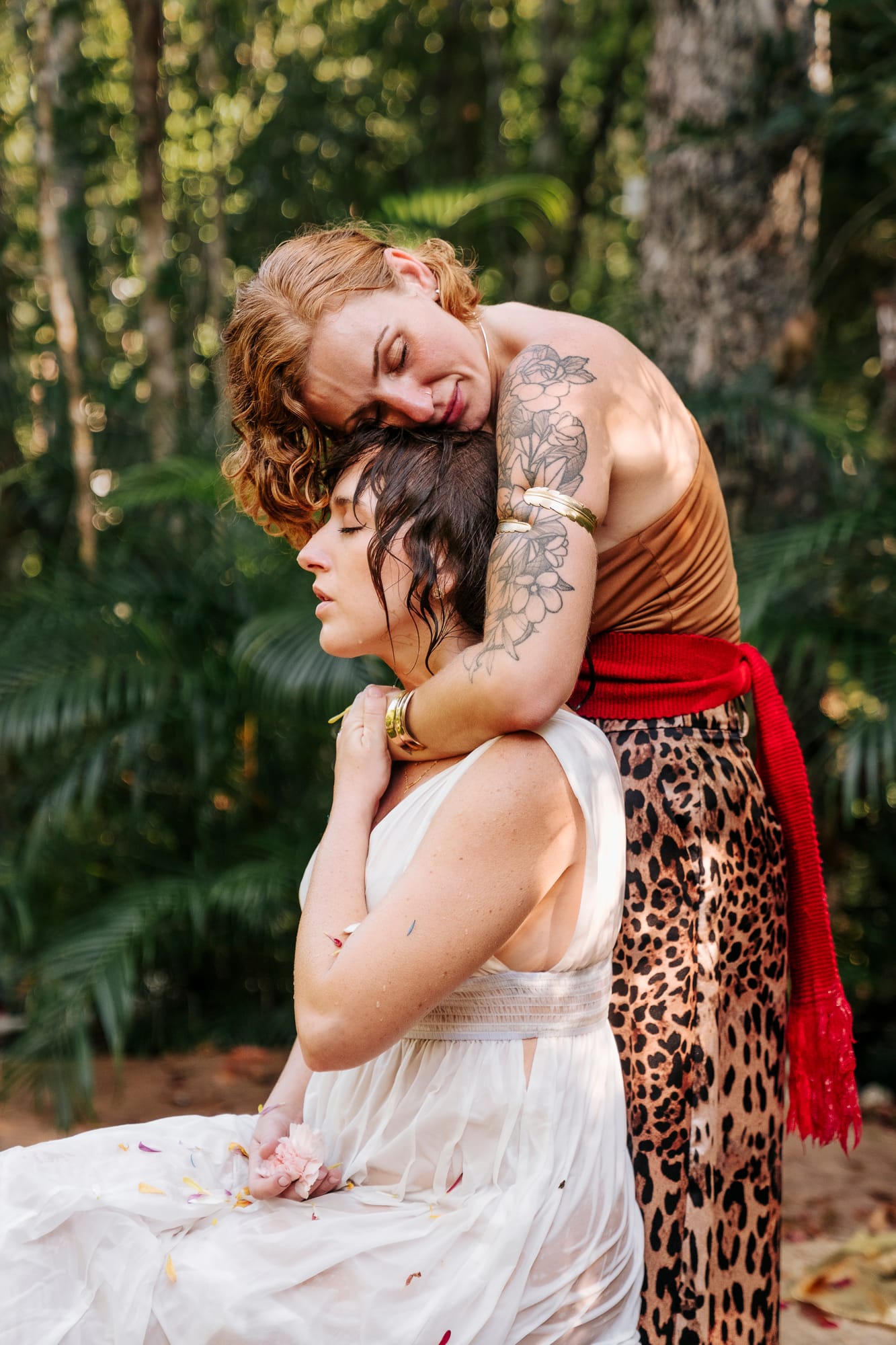 Klaudia holding a woman in an embrace at a REBÖRN retreat