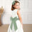 Thumbnail: Flower Girl with eucalyptus green sash bow belt and hair bow