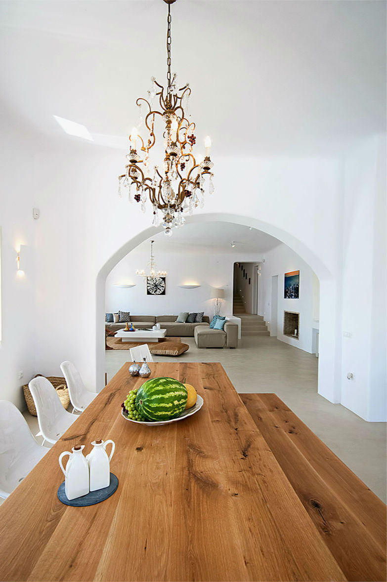 a wooden table with a watermelon and grapes on it