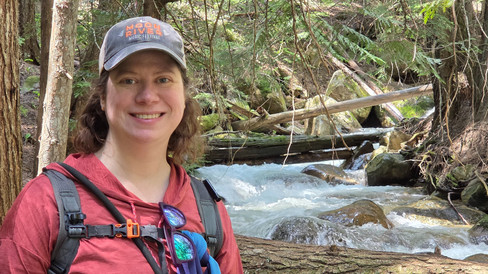 Beth hiking by a stream in Idaho