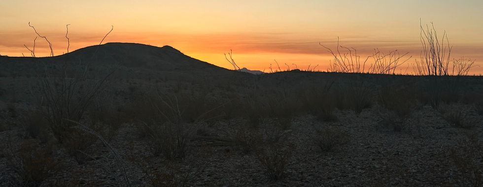 Sunrise over the desert, brighter yellows and oranges