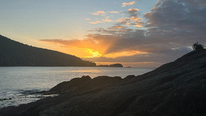 The sun peaks through the clouds