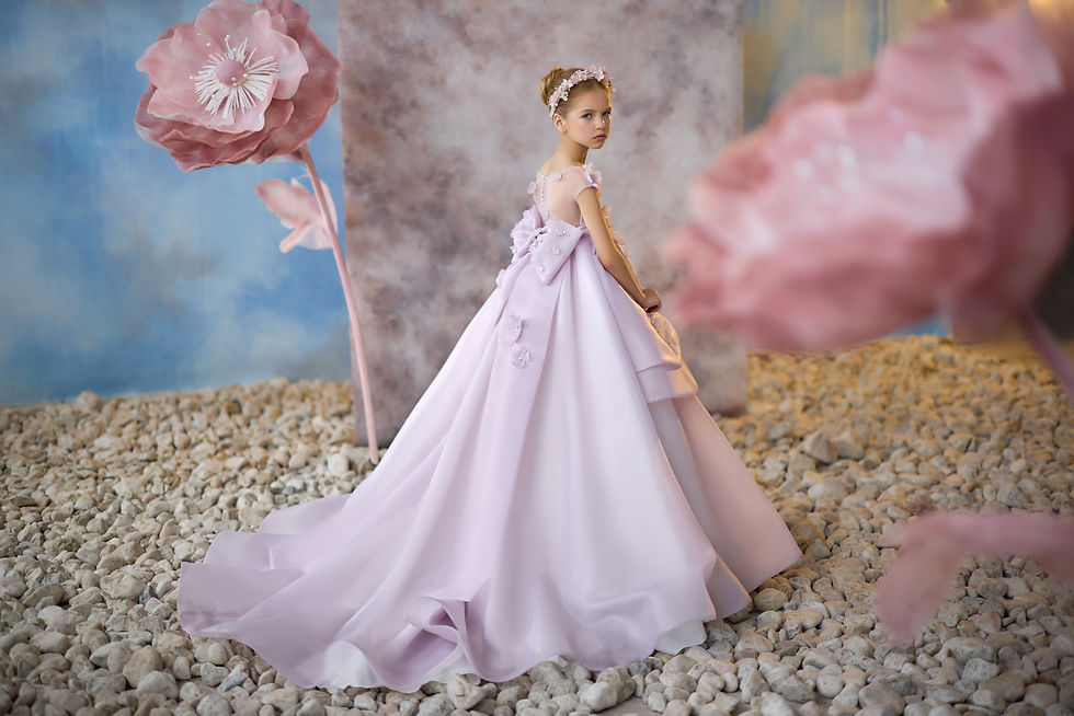 Lilac tiered girls special occasion dress with ruffles and floral detailing. Bow at the back and train  