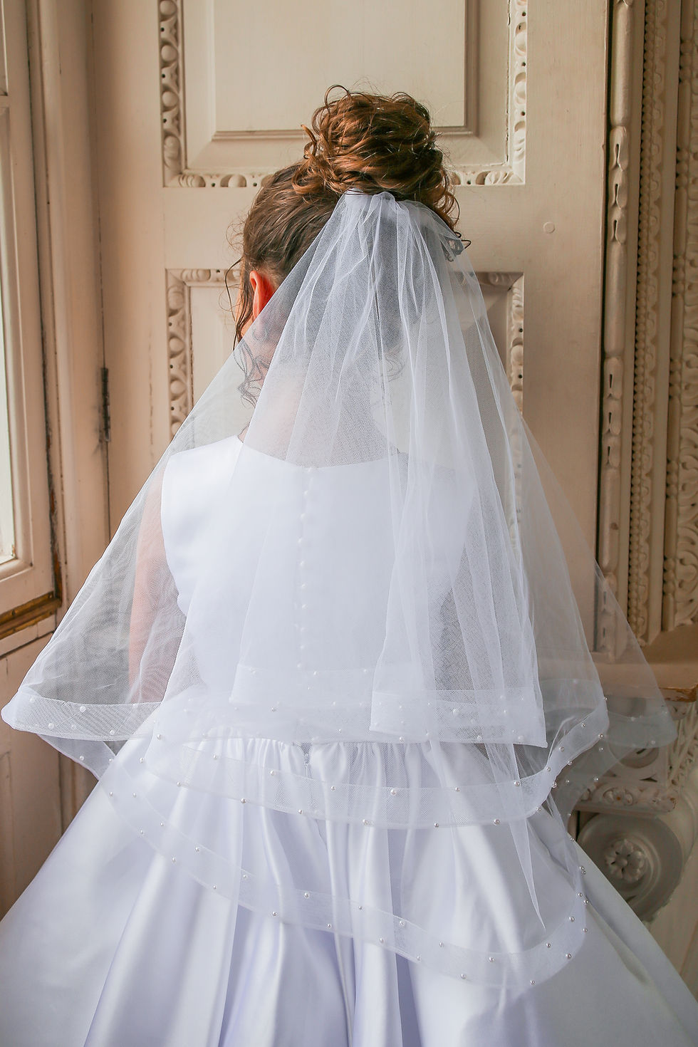 Luxury handmade pearl communion veil with horsehair from Crystal and Pearl Boutique.