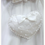 Thumbnail: White handmade heart shaped satin communion bag with white satin bow and pearl embellishment with pearl handle