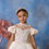 Miniaturbild: white girls special occasion dress with ruffle tulle skirt at bottom. Bodice has puff sleeves and beautiful white pearl embellished bodice 