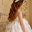 Miniature : close up back view of communion dress with layered tulle skirt and pearl detailing from crystal and pearl boutique