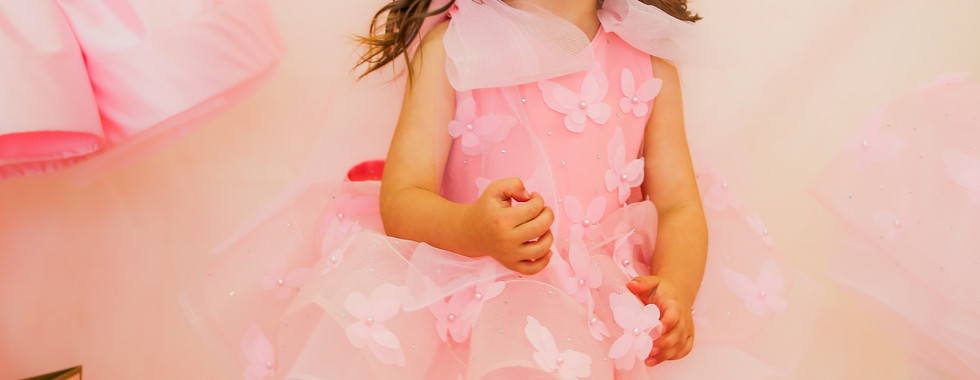 tulle pink party dress from crystal and pearl boutique with butterfly appliqué and bow sleeves
