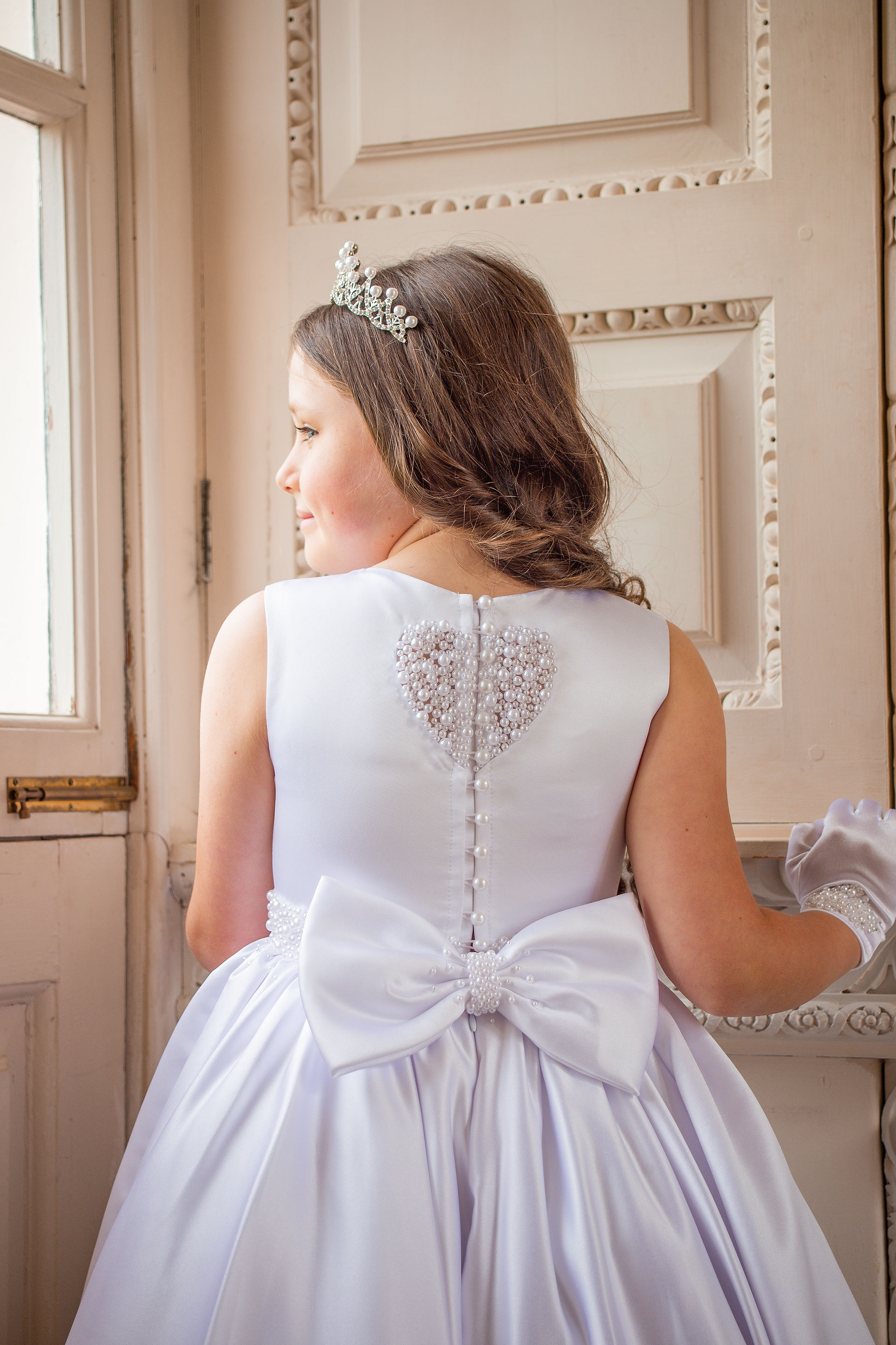 Satin communion dress/gala day dress from crystal and pearl boutique with bow and pearl heart at back 