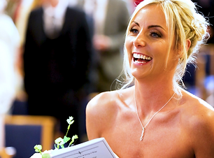 Bride laughing during wedding ceremony