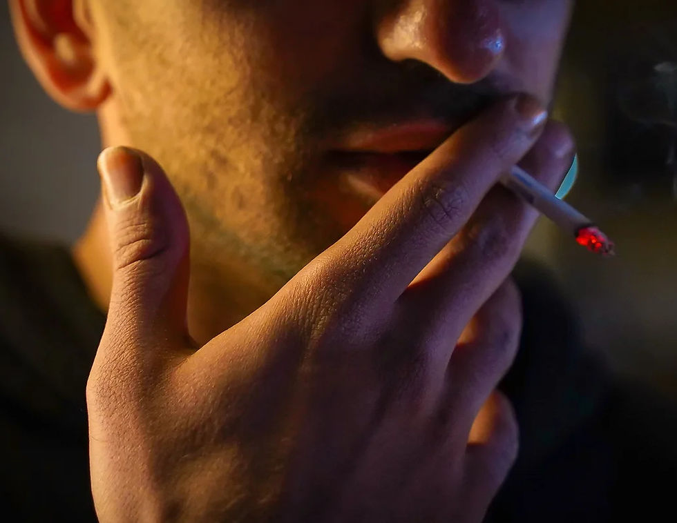 man smoking cigarette