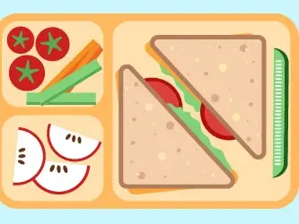 Healthy lunch tray featuring triangular sandwiches with fresh tomatoes and lettuce, accompanied by sliced veggies and apple slices.