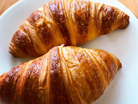 Two croissants on a white plate