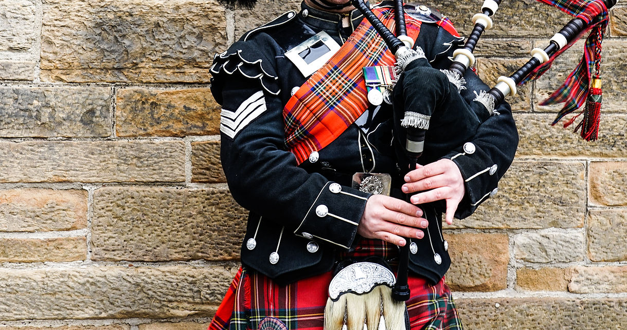 EDINBURGH, SCOTLAND, 24 March 2018 , Scottish bagpiper dressed in traditional red and blac