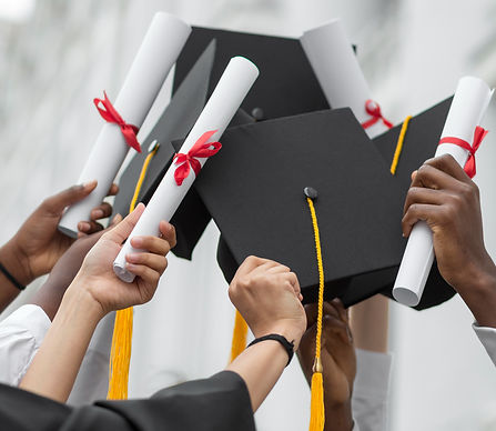 close-up-hands-holding-diplomas-caps_edited.jpg