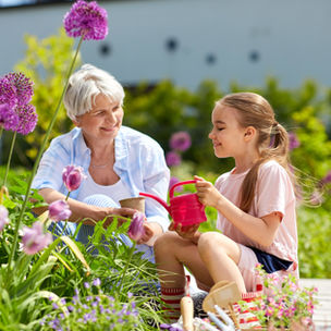 A lush garden with two two people enjoying