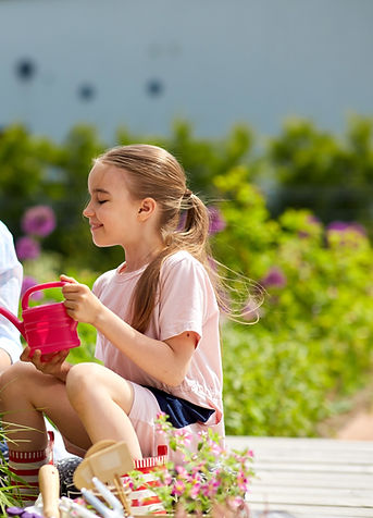 Children in outdoor nature learning garden