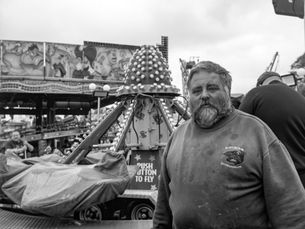 A fairground worker in black and white