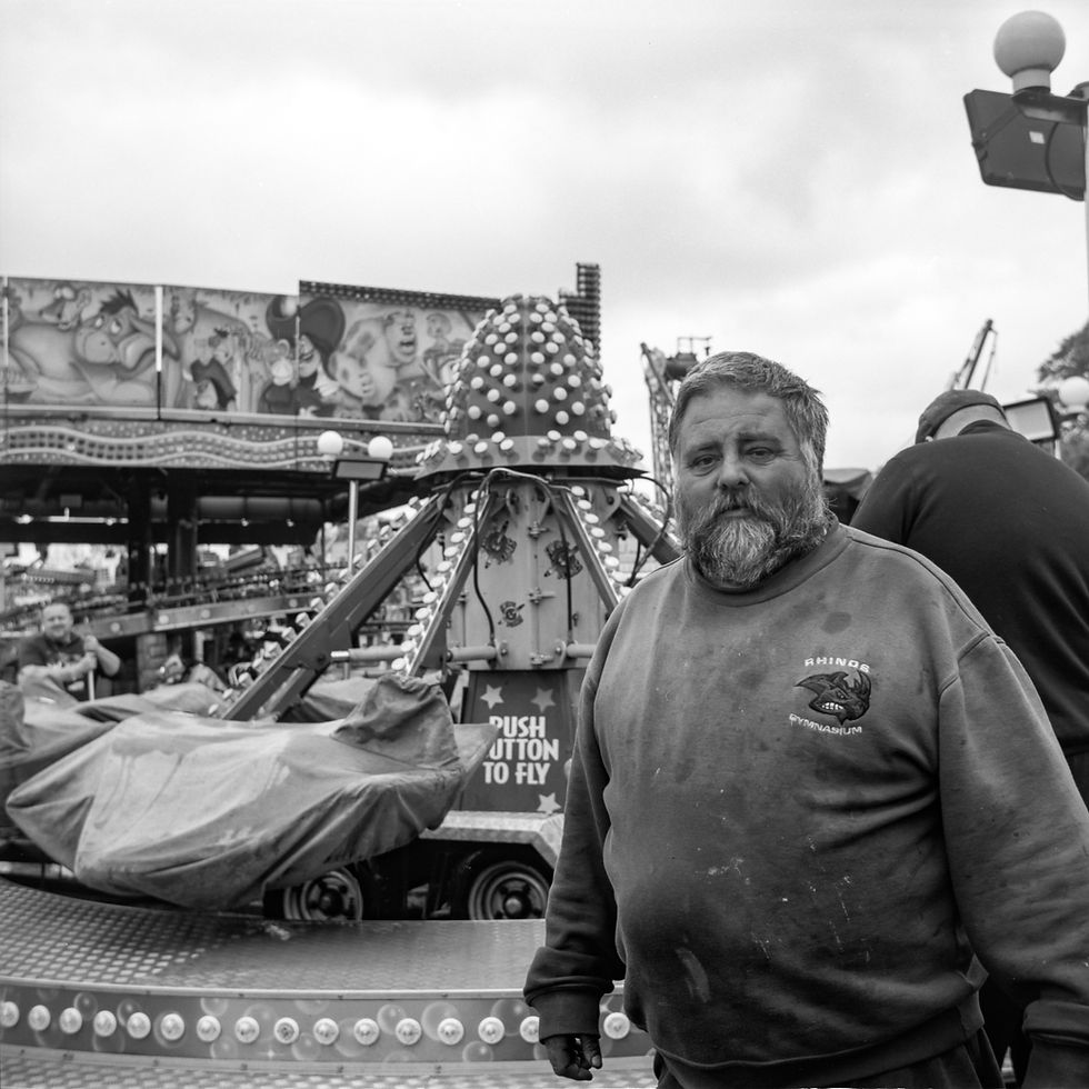 A fairground worker in black and white