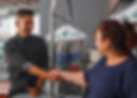 Juan Camacho shaking hands with a person at a laundy mat
