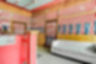 Amar Hotel’s reception desk with courteous staff ready to assist guests in a warm and inviting atmosphere.
