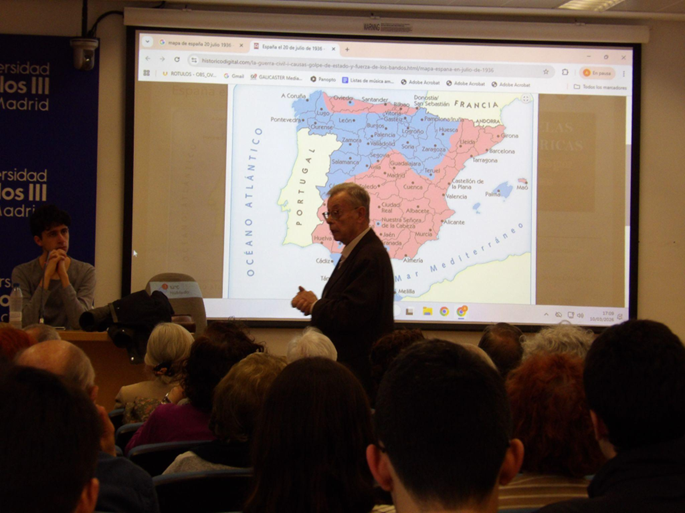 Portada: fotografía tomada durante la conferencia. Fuente: Asociación de Historia UC3M