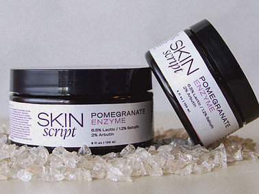 Skin Script's Pomegranate Enzyme sitting on a bed of crystals
