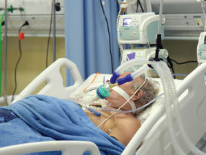 elderly man on ventilator at hospital
