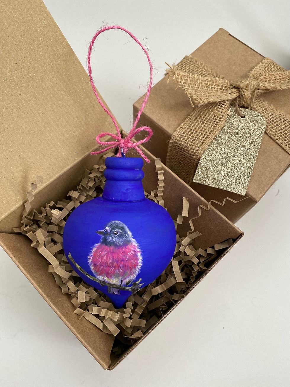 Thumbnail: Pink Robin on Blue Wooden Bauble