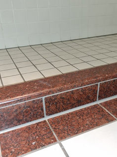 Sparkling clean red shower tiles AFTER professional clean by Bathroom Genie, Auckland