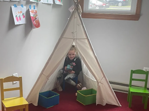 Child in tee pee at Mission Point Fellowship