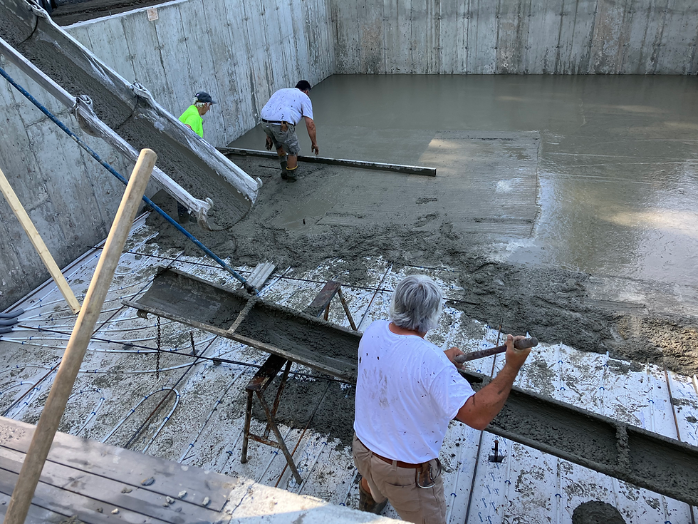 Joe Bertrand in the foreground still gets dirty even as the leader of his own contracting business