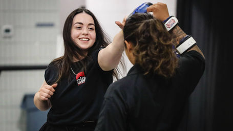 A woman participates in an interactive training portion of the Tulsa Police's Women in Policing event.