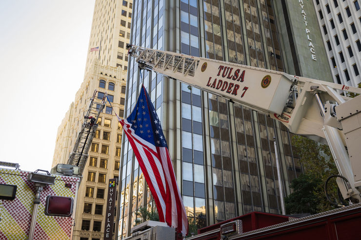 Tulsa Fire Trucks hoisting an American Flag