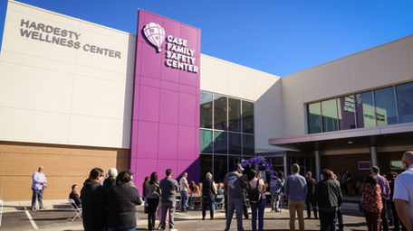 Crowd gathers for ribbon-cutting outside the Case Family Safety Center