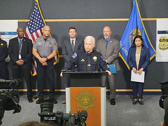 Chief Dennis Larsen speaks at a joint news conference with other members of law enforcement.