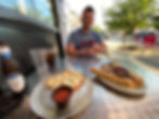 wide angle lens photo sitting at restaurant with breadsticks