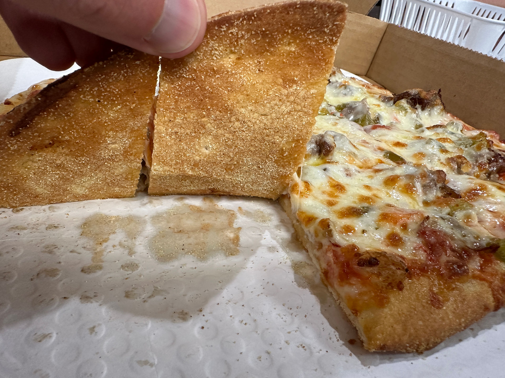 bottom side of crust from ninos pizza in noblesville indiana