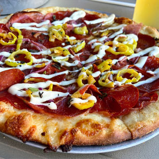 photo of italian pizza with toppings close up