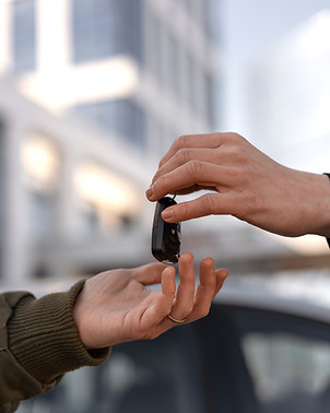 side-view-hands-holding-car-key.jpg