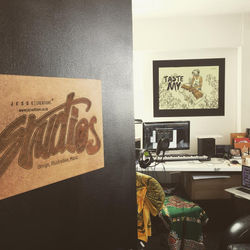 Open studio door with picture and desk