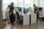 young-man-woman-using-detergent-vacuum-cleaner-cleaning-openspace-office.jpg