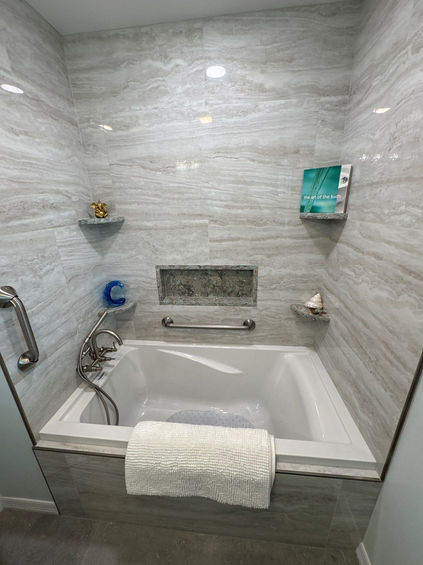 Spa-like bathroom with a luxurious soaking tub, tiles, and modern touches