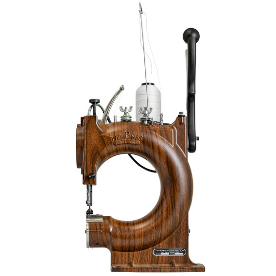 Side view of a vintage wood sewing machine. Excellent craftsmanship and design.