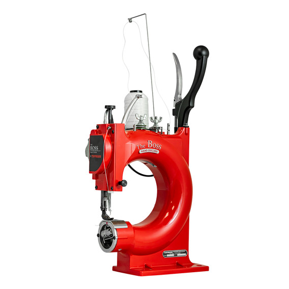 Red industrial sewing machine with visible text and detailed components in use.