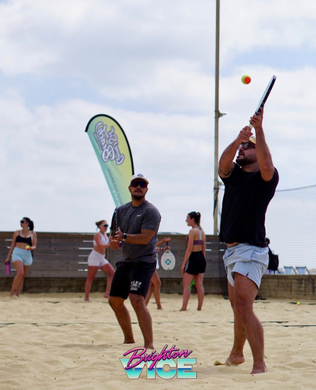 two beach tennis players playing during mens doubles event of the Brighton vice 2025 beach tennis tournament