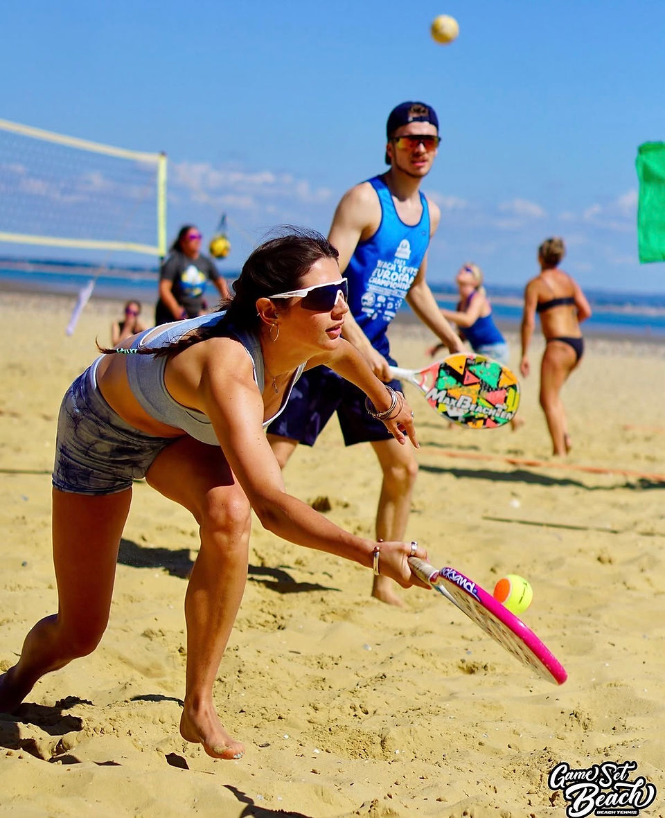 female beach tennis player enjoying the sport on sand during the beach tennis tournament 