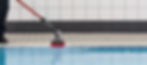 MotorScrubber M3 cleaning along the edge of a pool.