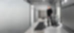 Male using MotorScrubber FORCE to clean underneath seating in a changing room.